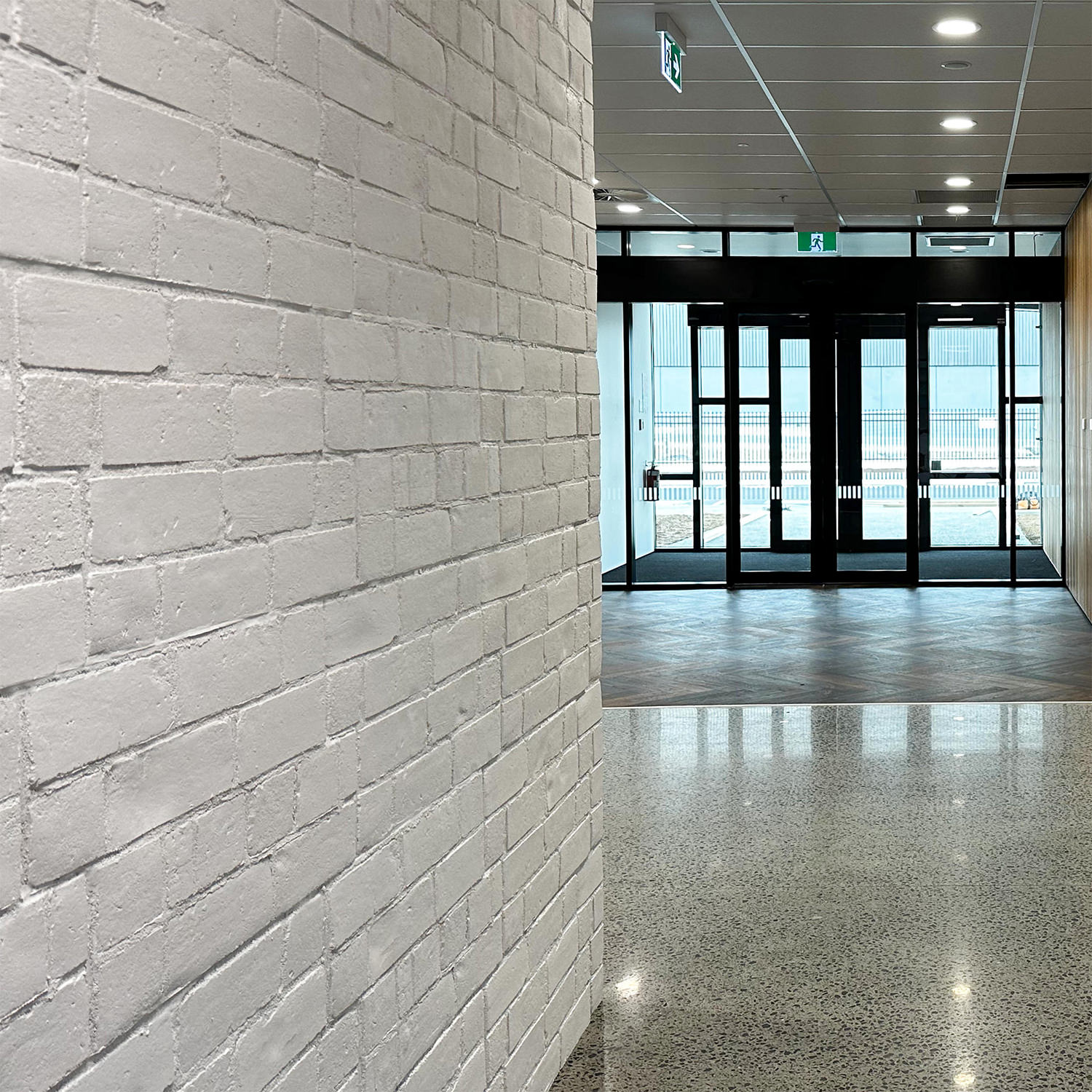 Thin-skins of faux white brick at Cotton On
